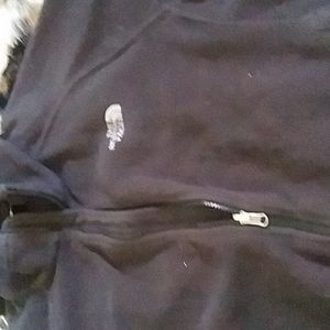 Dark grey North face jacket w/silver lettering size Large